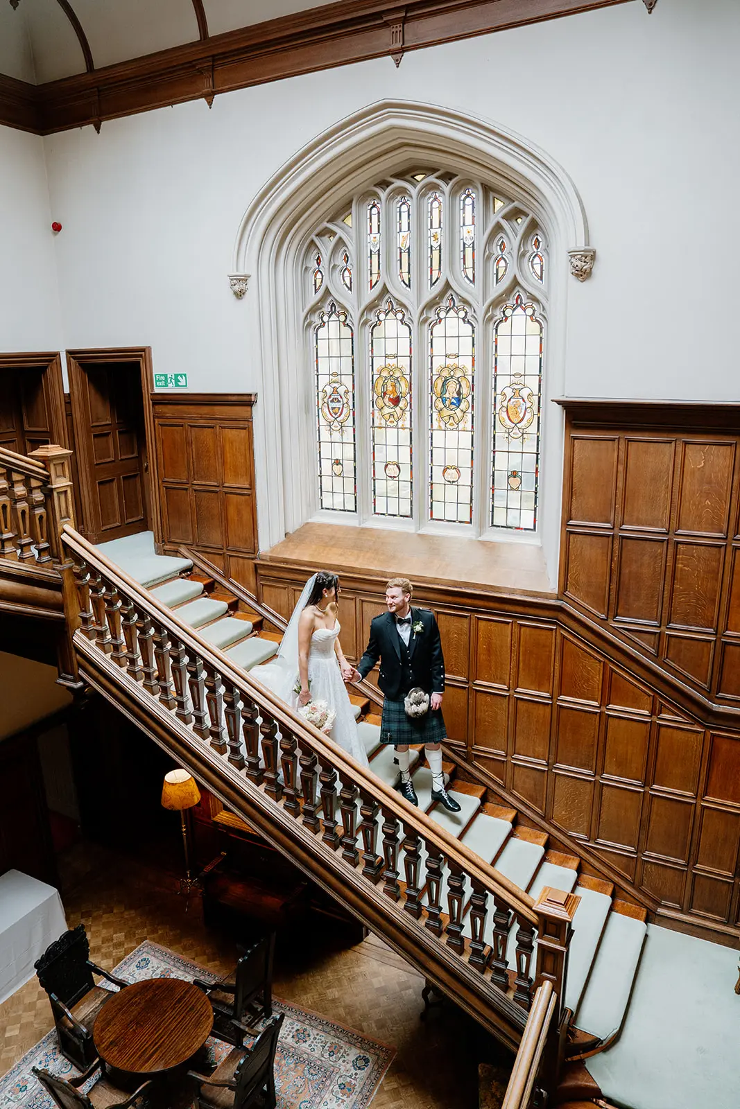 The couple on the grand staircase at Dundas Castle
