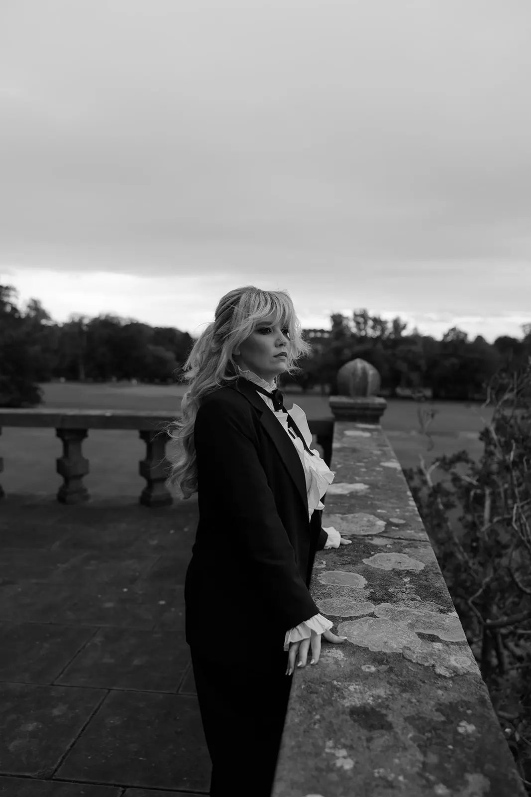 Louise Kennedy standing on a historic Scottish castle balcony