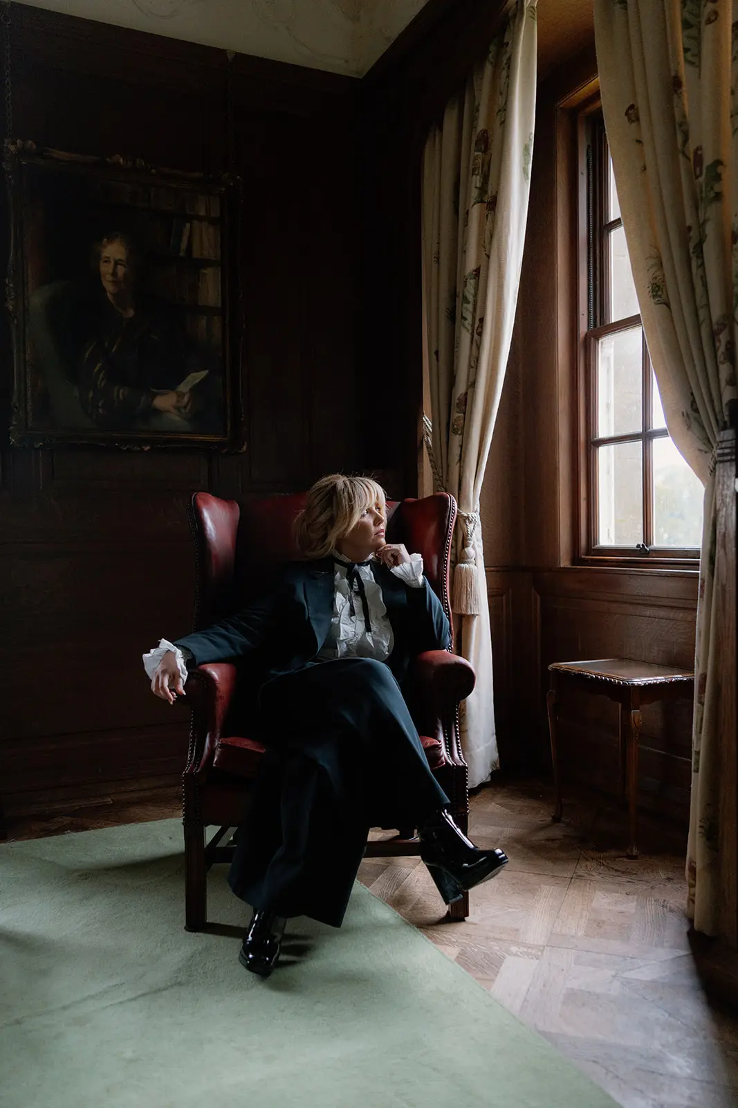 Louise Kennedy seated beside a window in an elegant Scottish venue