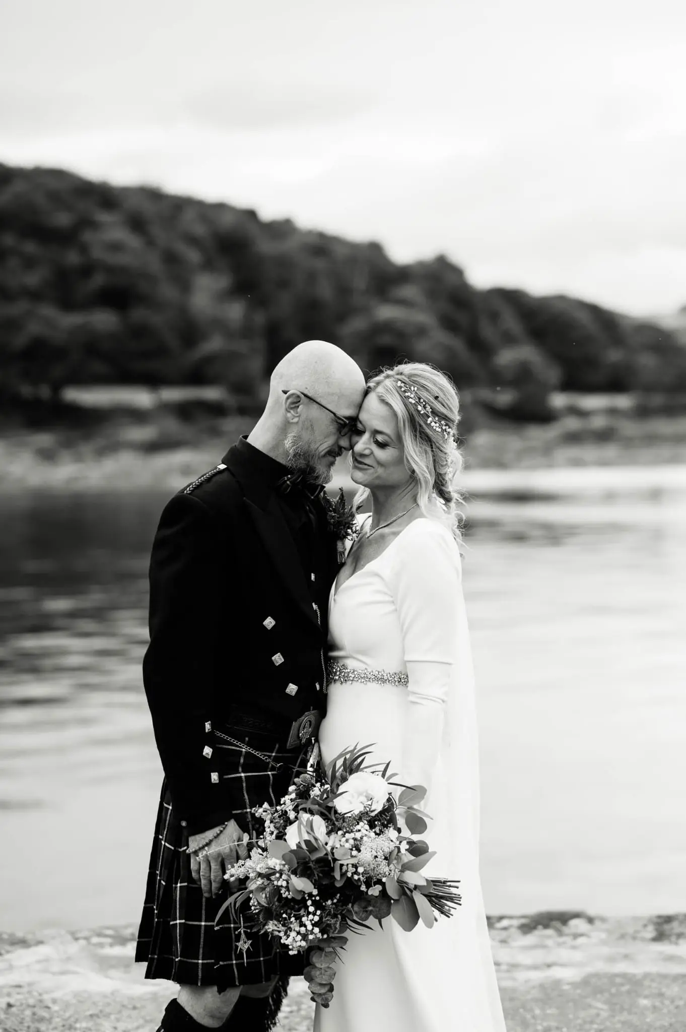 Bride overlooking a dramatic Scottish loch